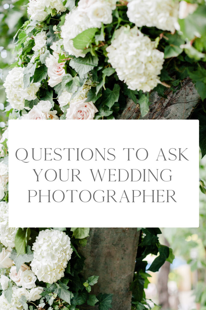 This is an image of white and pink wedding flowers covering a wall with a block of text overlaid that reads " Questions to ask your wedding photographer"