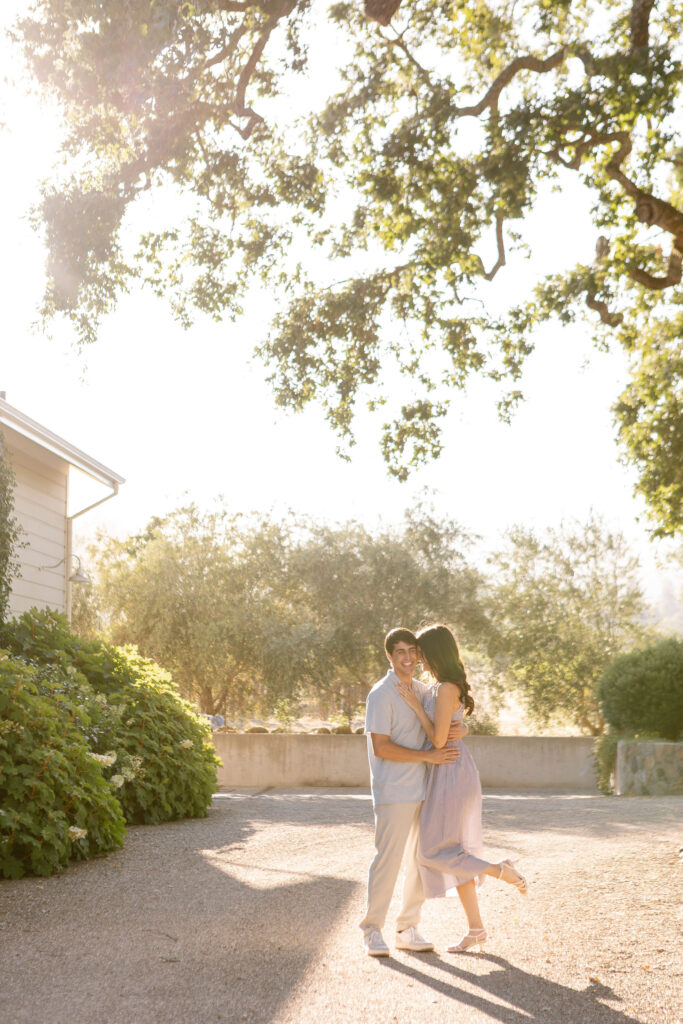 A couple newly engaged, celebrating their engagement at Spottswoode Winery in St. Helena