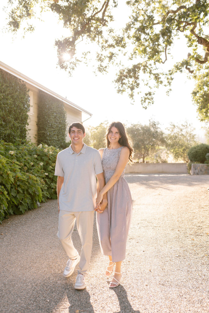 A couple newly engaged, celebrating their engagement at Spottswoode Winery in St. Helena
